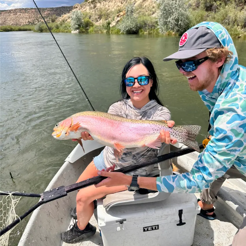 fisheads-guide-and-girl-with-large-rainbow-trout-850-850